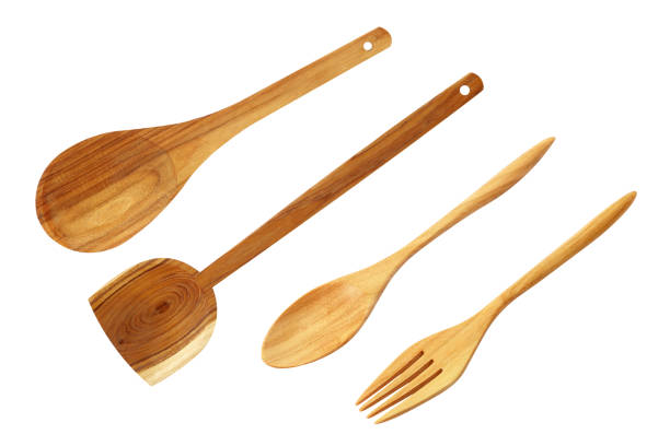 istock wooden spoons and wooden fork on white 1255326783