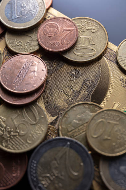 istock Golden dollar and EURO coins 1255329294