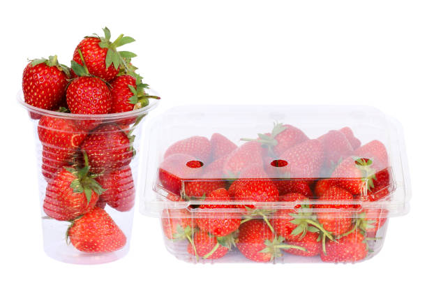 istock fresh strawberries in plastic cup and box 1255330626
