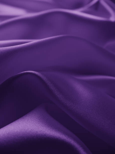 istock Beautiful elegant wavy violet purple satin silk. 1255333686