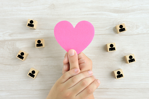 Good human relationships images, heart object covered by child's hands