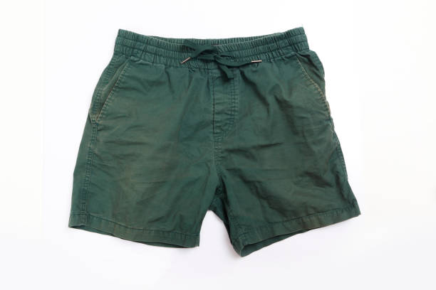 istock men's green shorts on a white background. 1255333715