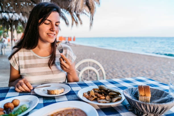 dinner by the sea - greek culture bar restaurant greece imagens e fotografias de stock