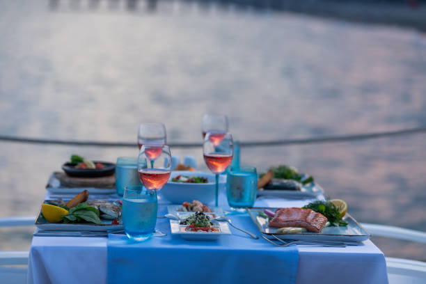 istock Various seafood dinner table ready at seaside with appetizers and drinks at afternoon 1255337803