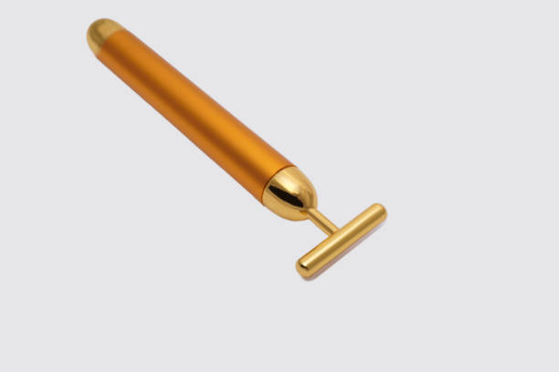 istock High End Golden Facial Roller Massager 1255339097