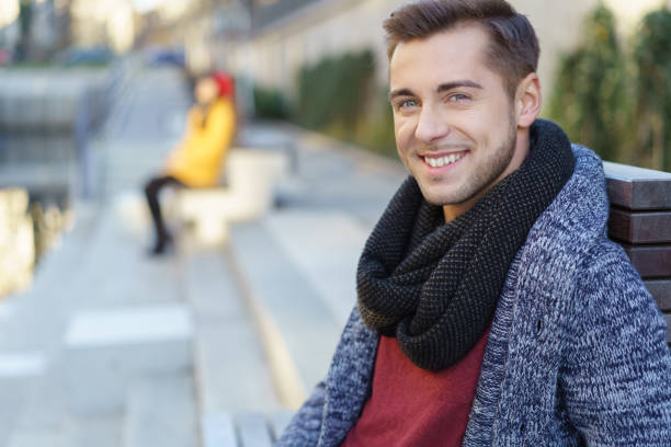 istock Smiling handsome young man outdoors in the city 1255341825