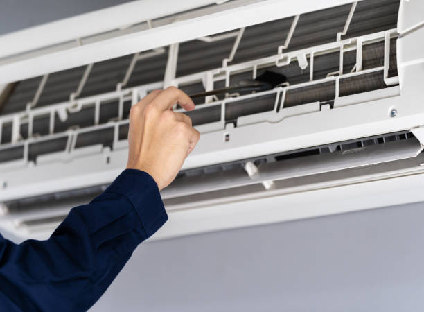 istock close up technician service using brush to cleaning the air conditioner 1255345013
