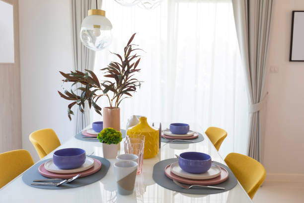 istock Table set with yellow chair and colourful plate in modern style dining room. 1255345752