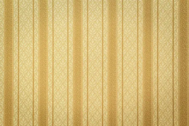 Photo of Gold striped wallpaper with floral pattern