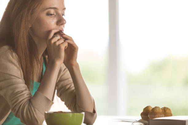 istock Eating cookies she got in a care package from a friend 1255353109