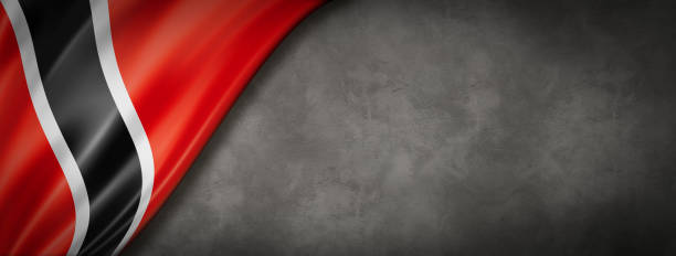 Trinidad And Tobago flag on concrete wall banner Trinidad And Tobago flag on concrete wall. Horizontal panoramic banner. trinidad culture stock pictures, royalty-free photos & images