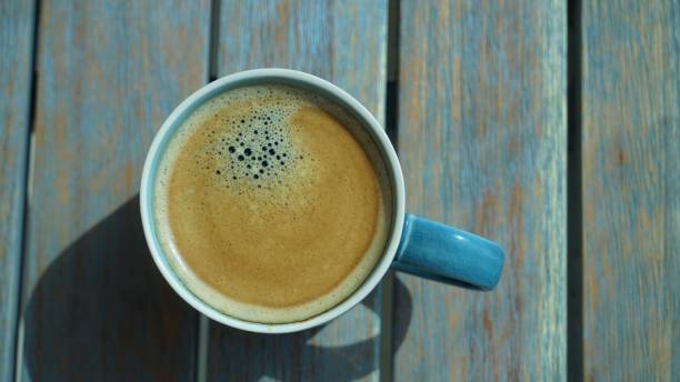 istock Top view on fresh aroma coffee in porcelain cup 1255355405