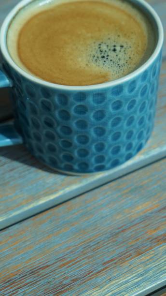 istock Top view on fresh aroma coffee in porcelain cup 1255355433