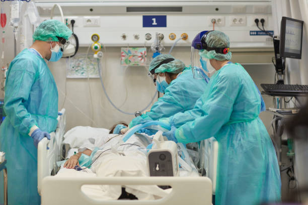 istock Hospital Team Caring for Patient with Infectious Disease 1255356849