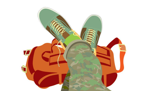 Feet raised up in unlaced sneakers Rest at a rest stop, unlaced sneakers, legs raised up. The backpack is removed, relaxation after a hike. feet up stock illustrations