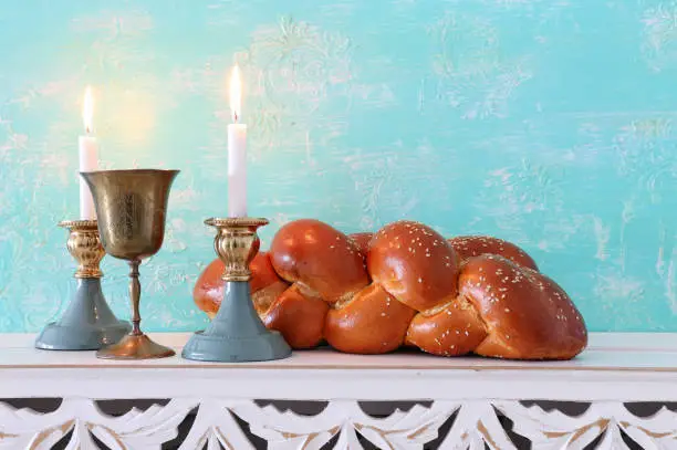 shabbat image. challah bread, shabbat wine and candles