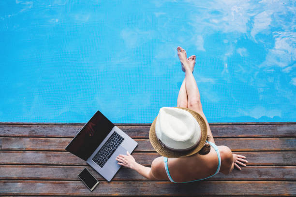 istock Woman work with laptop outside. 1255359004