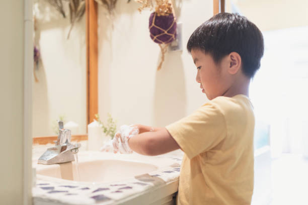 istock Boy washing hands in labotary at home 1255360422