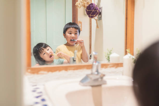 istock Sibling brushing his teeth in labotary at home 1255360427