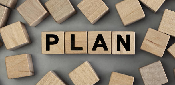 istock Word PLAN made with wood building blocks. Top view 1255361333