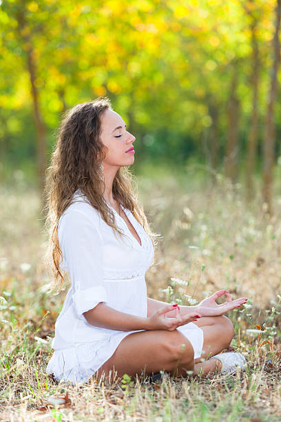 istock Beautiful Girl Doing Yoga Exercises 125536231