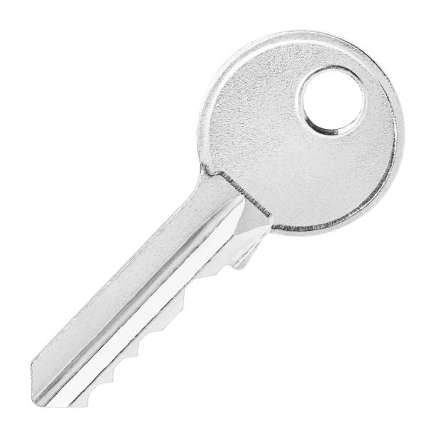 istock Close-up of single house key on white 1255363628