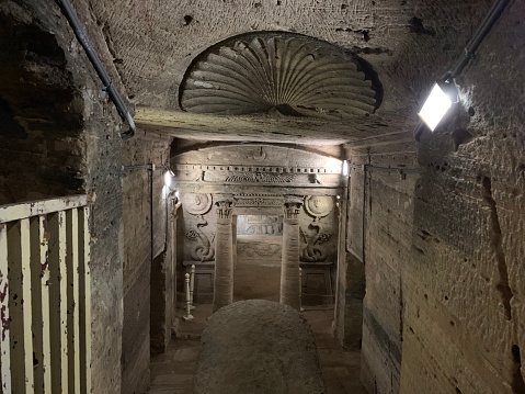 The catacombs of Kom El Shoqafa meaning `Mound of Shards` is a historical archaeological site located in Alexandria, Egypt, and is considered one of the Seven Wonders of the Middle Ages