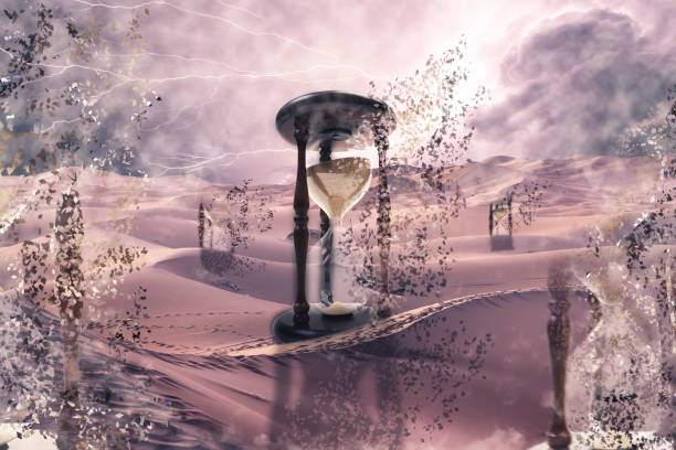 imagem surrealista de ampulhetas com um efeito dispersivo em um deserto. conceito de falta de tempo, fim da vida - magic hour - fotografias e filmes do acervo