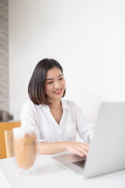 istock Beautiful Asian lady in a cafe 1255368217