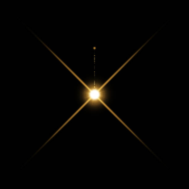 istock Gold warm color bright lens flare flashes leak for transitions on black background 1255368582