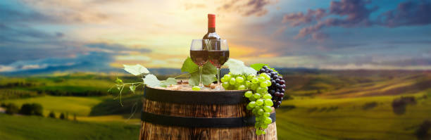 istock red wine bottle and wine glass on wodden barrel 1255371269