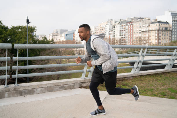 istock Portrait of an athletic man running. 1255373023