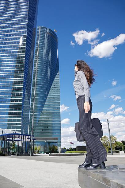 two skyscrapers and businesswoman stock photo