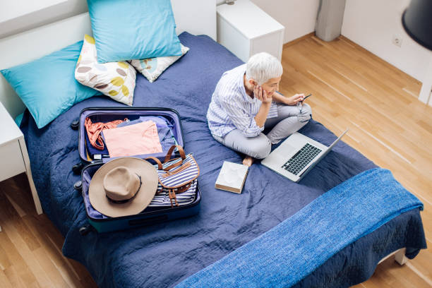 happy mature woman exploring her travel destination before going on a journey - Ensuring Peace of Mind: Allianz Travel Singapore Leads the Way in Travel Insurance Excellence