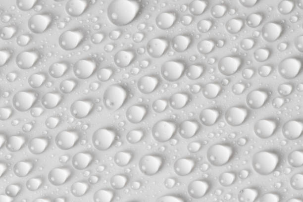 istock Water drops on gray background. Top view. Closeup. 1255377391