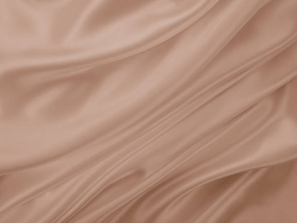 istock Beautiful elegant wavy beige or light brown satin silk. 1255379465