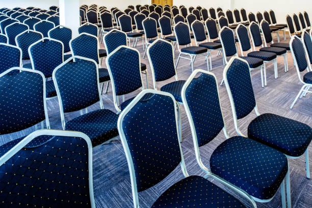 istock Convention hall with seats in a row with no people. 1255380975