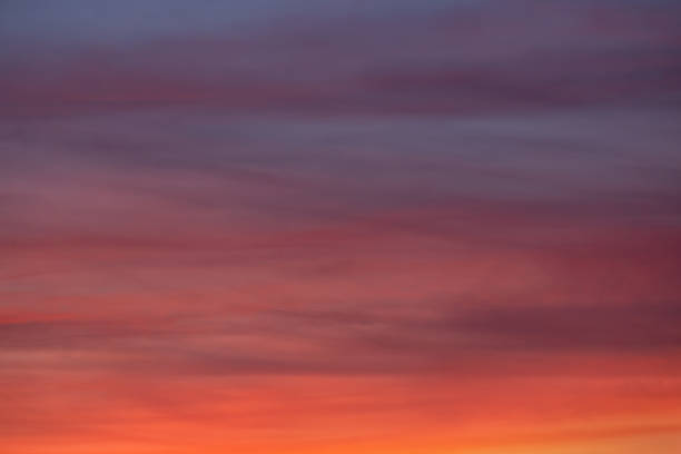 istock background of dawn cloudscape with red clouds 1255383514