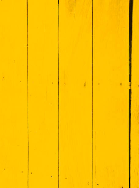 istock wood surface with yellow color paint 1255384856
