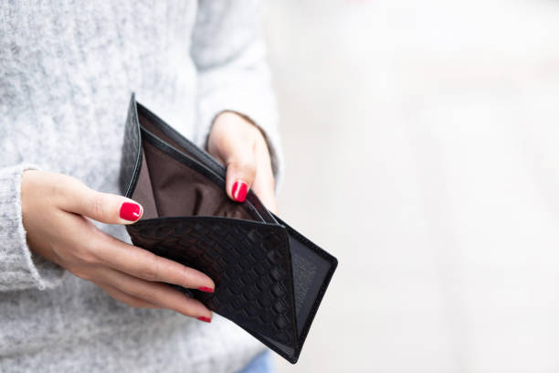 istock A woman carrying a wallet while shopping at a mall 1255388354