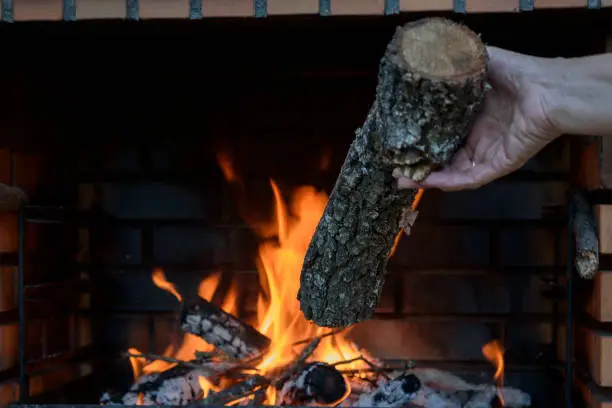 Photo of Barbecue lit and with flames, prepared to grill food on the outside. Eat in the garden.