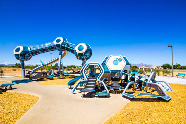 Futuristic Playground Equipment At Free Public Park Futuristic Kid's Playground Equipment At Free Public Park blue and green braces stock pictures, royalty-free photos & images