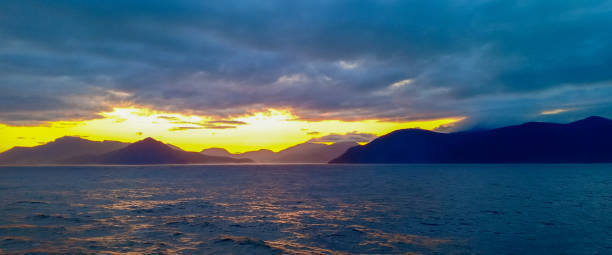 istock ocean mountain sunrise and cloudy sky 1255394220