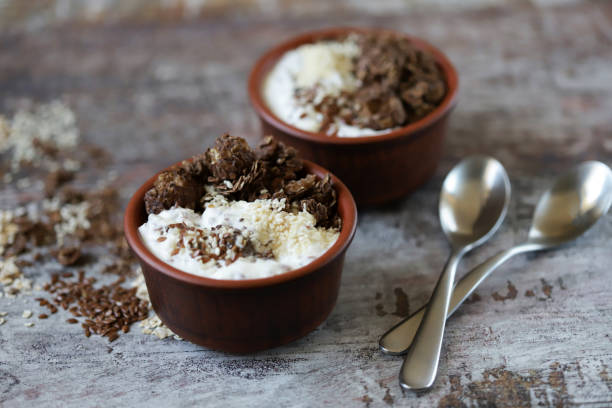 istock Healthy breakfast with white yogurt, chia, seeds and chocolate granola. 1255396560