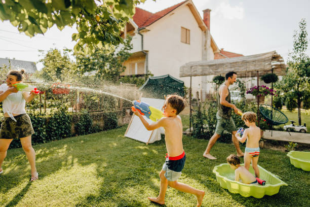 istock Water fight in our yard 1255397343