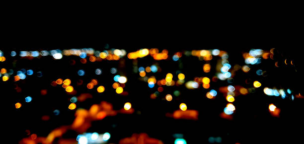 istock Bokeh Colored city lights on black background 1255398692