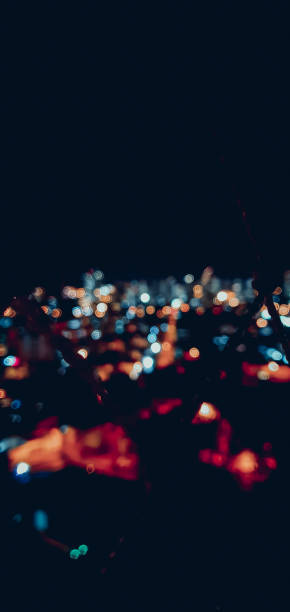 istock Bokeh Colored city lights on black background 1255398698