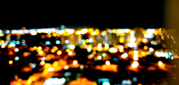 istock Bokeh Colored city lights on black background 1255398706