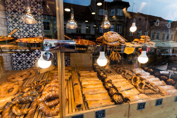 Brasov, Romania - 23 June, 2020: large selection of pretzels and other baked pastries arranged nicely and on display in a bakery shop window.