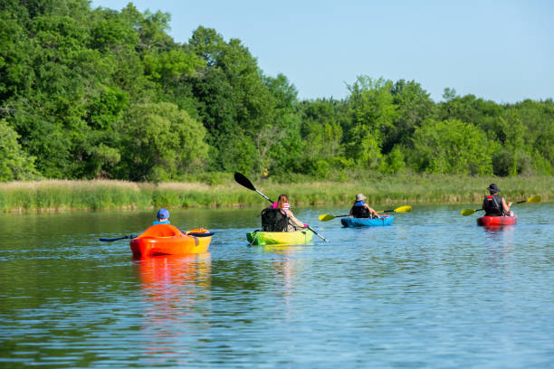 istock Family Kayaking on Lake in Summer 1255401659